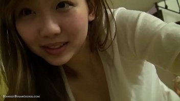 Adarable busty asian teen at home with toys